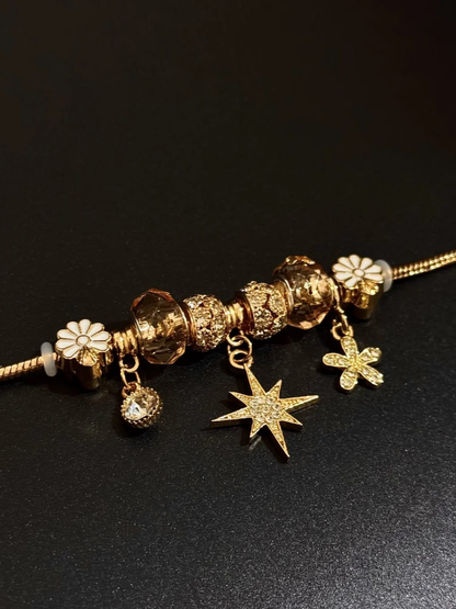 Gold Starburst and Flower Charm Bracelet