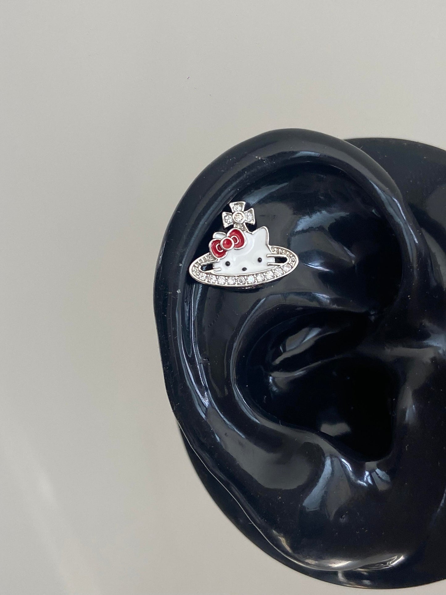 Kitty Saturn Emblem Helix Earrings