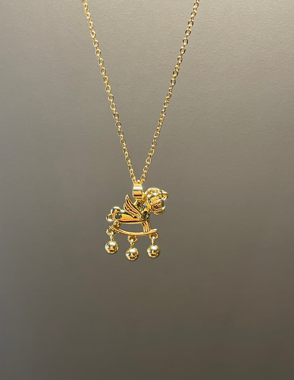 Gold Winged Rocking Horse Necklace