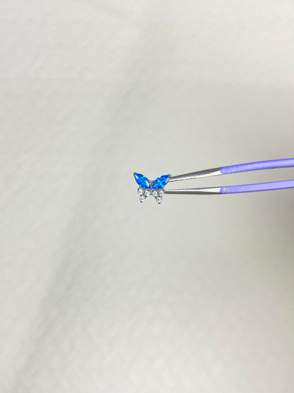 Silver Blue Crystal Butterfly and Cross Triple Lobe Earring Stack