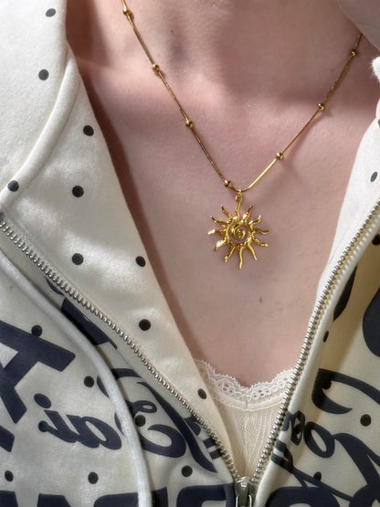 Gold Spiral Sunflare Necklace